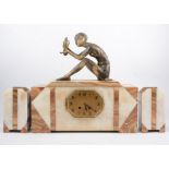 An Art Deco clock garniture, mounted with a patinated spelter female with parrot