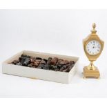 A moonstone and onyx chess set and board, another chess set, and a brass mantel clock