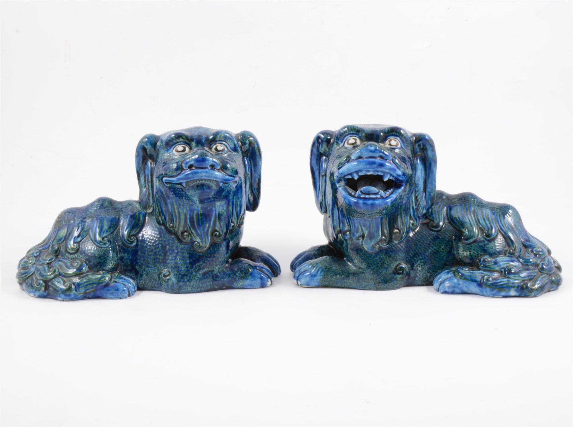 A pair of Guangdong blue and green glazed lions, late Qing