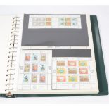 A collection of stamps - two albums Isle of...