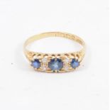 A sapphire and diamond half hoop ring, three sapphires spaced by two pairs of old cut diamonds in