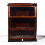 Stained mahogany three height sectional glazed bookcase.