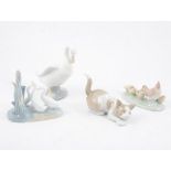 One Lladro cat and eight Nao animal and bird figures, (9)
