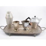 A Picquot Ware five piece teaset, other brass and copper wares, handbells, money box, plated wares.,