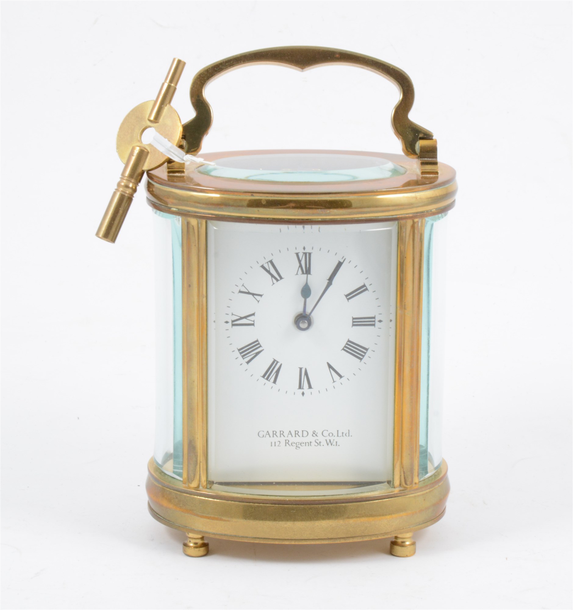 A Garrrard & Co of 112 Regent St. W.1, French style brass carriage clock, oval case with oval glass