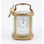 A Garrrard & Co of 112 Regent St. W.1, French style brass carriage clock, oval case with oval glass