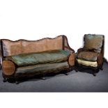 Three-piece walnut framed bergere suite, double cane panels