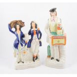 Staffordshire figure, Organ Grinder, and a theatrical group (2)