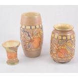 Three Burleigh Ware vases - in the "Pomegranate" design two signed by Charlotte Rhead 23cm and 17cm,