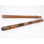 A Warwickshire Constabulary decorated truncheon, painted in red and gold, with ribbed grip, 44cm,