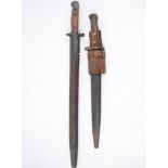 Two Bayonets, one marked Wilkinson 1907 with two piece wooden grip in a steel mounted leather sheath