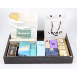 Vintage Perfumes, a collection of perfumes,original packaging on a faux crocodile skin tray to
