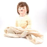 Bisque head character doll, composition body, together with a Victorian stained beechwood turned