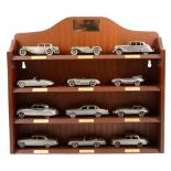 Danbury Mint Jaguar The Classic Motor Car pewter cast models, three wooden wall shelf units of