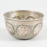 Small white metal coin cup, unmarked, set with Brunswick Mariengrosch. coins, 1667-88.