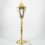 A brass table lamp in the form of a gas street light, and a carved oak cased barometer by Bolt,