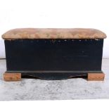 Pine blanket box, upholstered top, raised on block feet, cotton print covers, width 105cm.