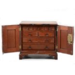 A mahogany two door table cabinet with fitted interior