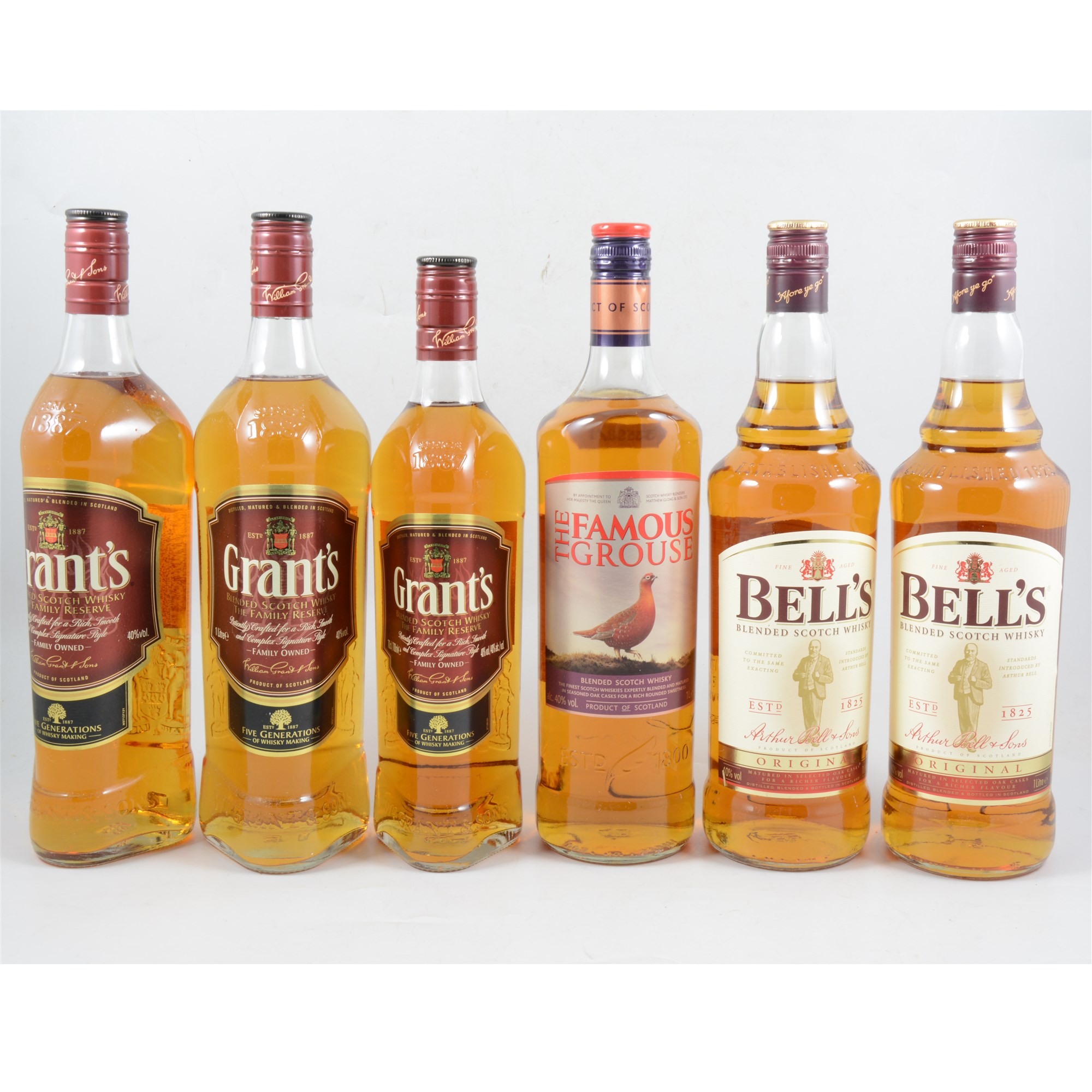 Six bottles of blended Scotch whisky, comprising Grant's, Bell's and Famous Grouse