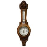 Carved oak aneroid barometer, the dial signed Benetfink & Co. Ltd, Cheapside, thermometer over,