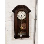 Modern stained wood wall clock, the dial signed Hermle, spring driven movement striking on five