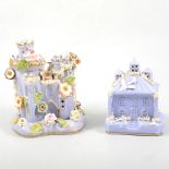Large lilac coloured castle model, separate base, and a smaller lilac coloured cottage model. (2)
