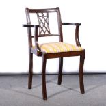 Ercol stained beechwood and elm rocking chair, and two other elbow chairs.
