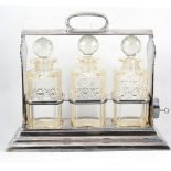 Walker & Hall silver plated three-bottle tantalus, with key.