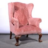 Traditional wing-back easy chair.