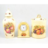 A collection of Aynsley "Orchard Gold" items, including plates, vases and a clock