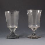 George III glass goblet, bell-shape bowl; and a Regency goblet, bucket bowl (2).