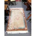 Chinese sculptured rug, fawn ground, bordered outlines,