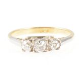 A diamond three stone ring, the old cut stones graduated in size square set in a yellow and white