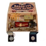A vintage Liquorice Allsorts box containing a collection of miscellaneous items, including an Arts