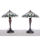 A pair of modern Tiffany style table lamps, bronze effect circular fluted bases supporting coolie