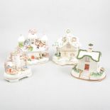 A collection of eleven Staffordshire pottery cottages and pastille burners.