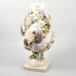 German porcelain urn shape vase, encrusted floral decoration and modelled with birds, (restored)