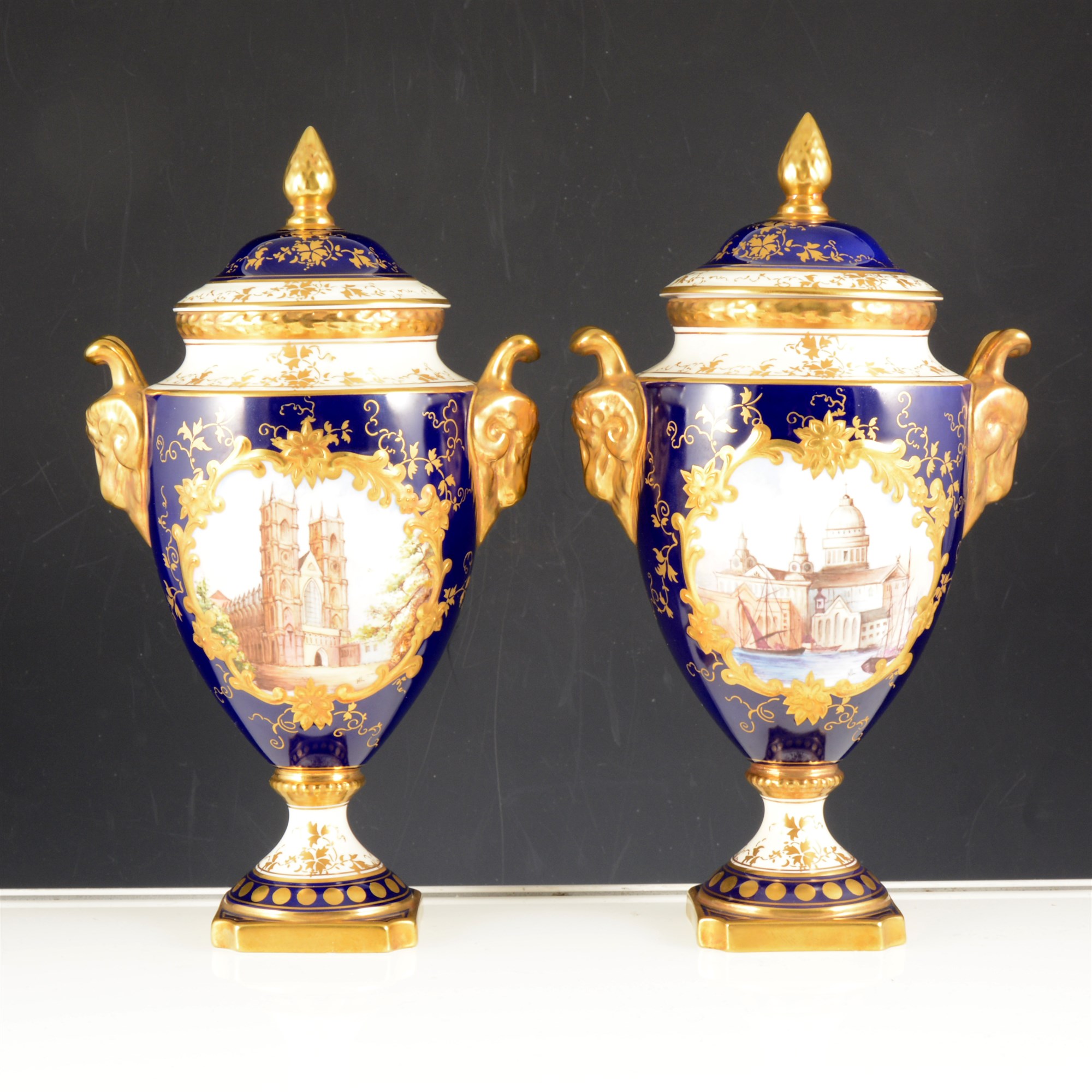 Pair of Coalport urn shaped covered vases, Westminster Abbey and St. Pauls Cathedral.