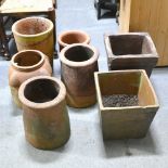 Collection of terracotta plant pots and chimney pots,