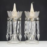 Two cut-glass candle lustres, each with eight prismatic drops.