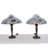A pair of modern Tiffany style table lamps, bronze effect rose design bases supporting coolie glass