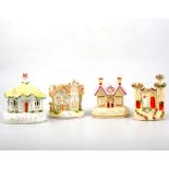 A collection of twenty five Staffordshire pottery cottages and pastille burners.