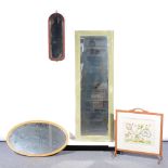 Oak fire screen, with a needlework panel, width 60cm; an oval gilt framed wall mirror; a mahogany