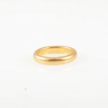 A 22 carat yellow gold wedding band, 4.3mm wide D shape with a plain polished finish, ring size Q,