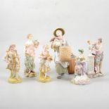 Pair of French bisque figurines of a young couple, and seven other Continental figures (9).