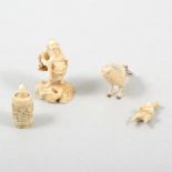 A Japanese ivory netsuke of a warrior and three other small carved ivory items (4)