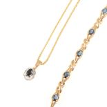 A 9 carat yellow and white gold oval sapphire and diamond cluster pendant on a 45cm box link chain