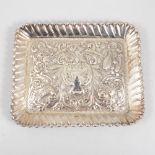 A silver tray by Army & Navy Cooperative Society Ltd, repousse chased decoration with vacant