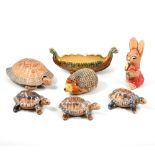 A collection of Wade Pottery pin boxes, Whimsies, and Pendelfin figures.