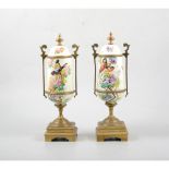 Pair of French gilt metal and painted enamel garniture urns.